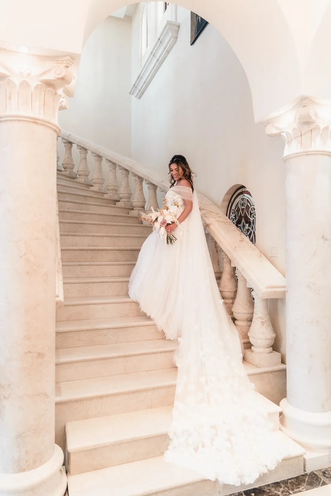 Bride portrait on the stairs at Villa la Joya Destination Wedding Venue in Riviera Maya Mexico