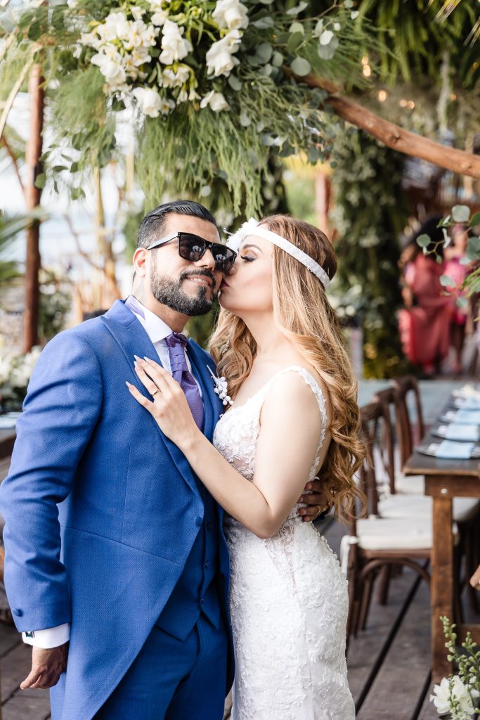 Bride and groom posing at their destination wedding in Cozumel, Mexico.