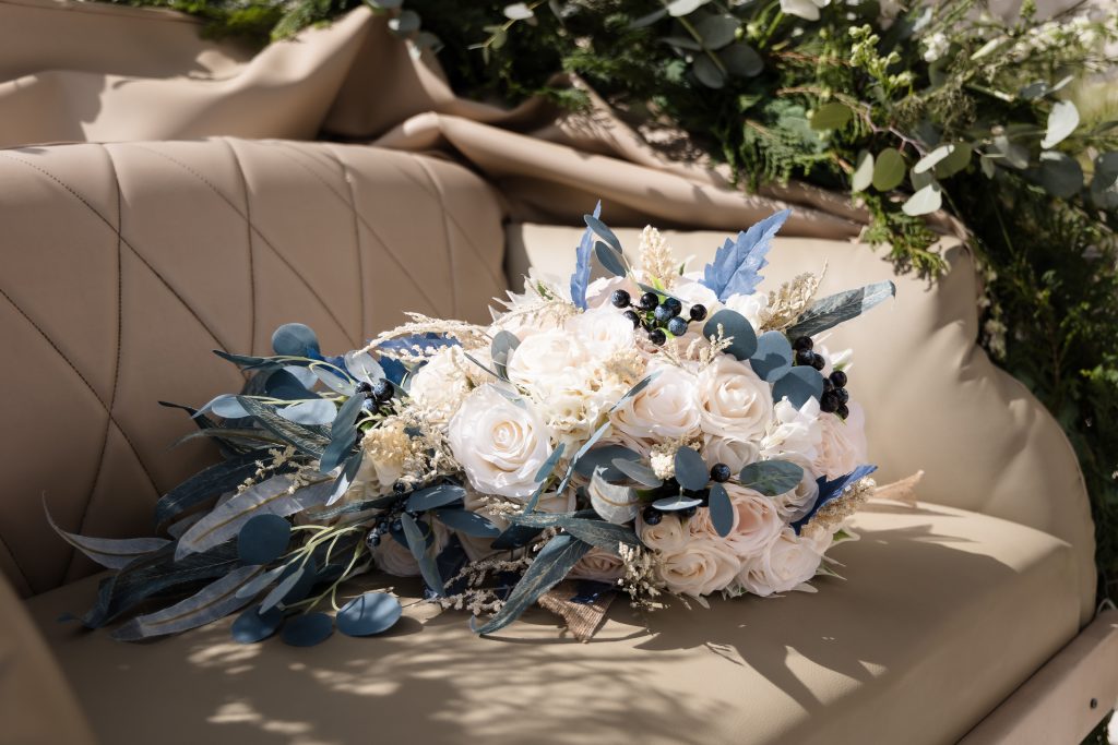 Floral detail and bouquet on a horse carriage at destination wedding in Cozumel Mexico