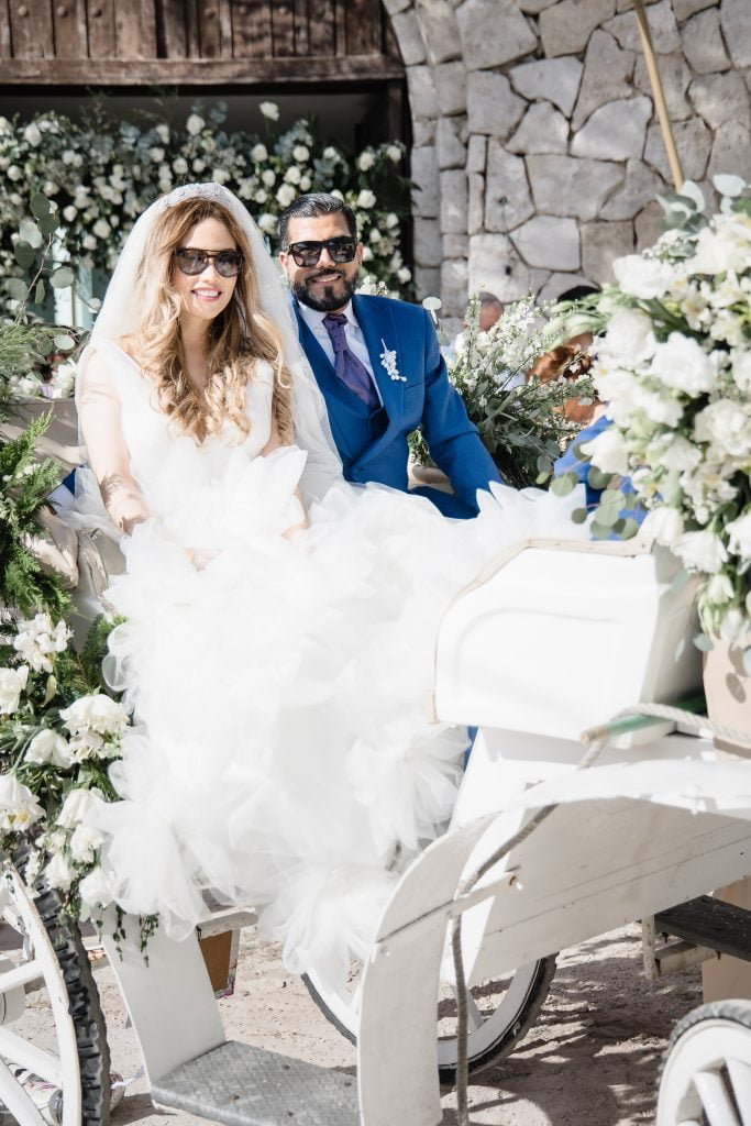 Bride and groom on horse carriage. Destination Wedding at Hemingway Cozumel Mexico