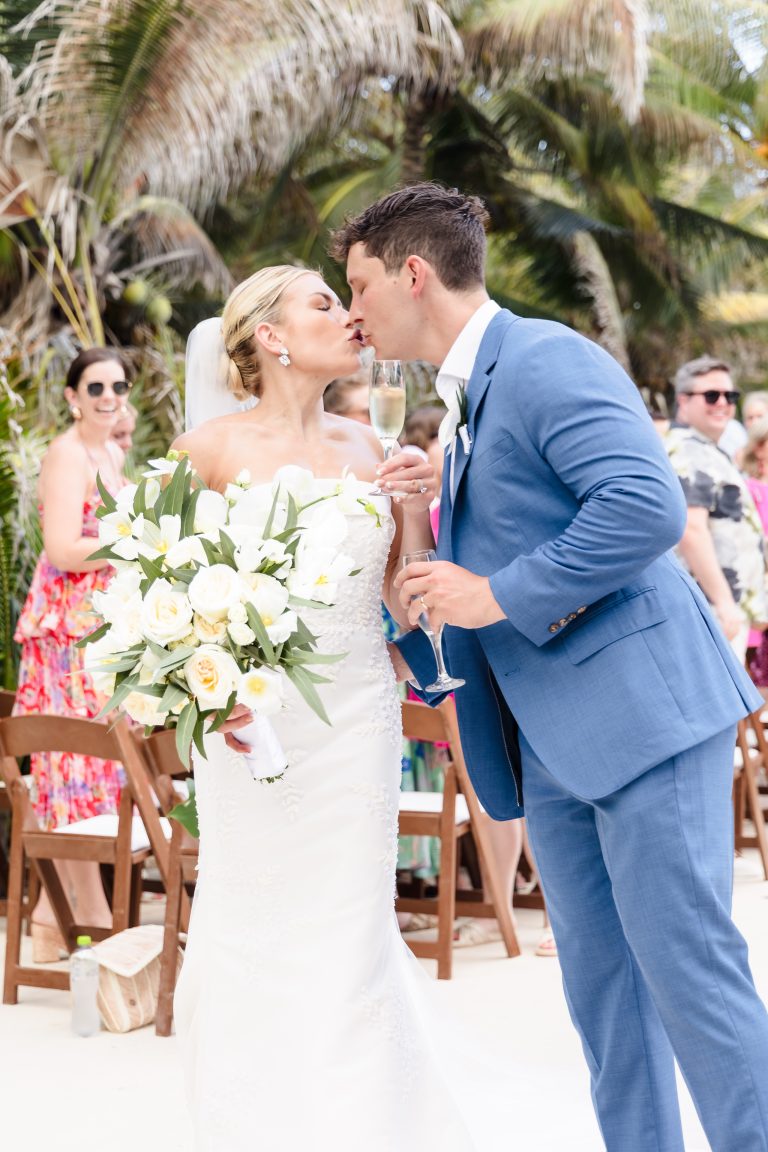 Bride and groom kissing after the destination wedding ceremony in Mexico. Hotel UNICO 2087
