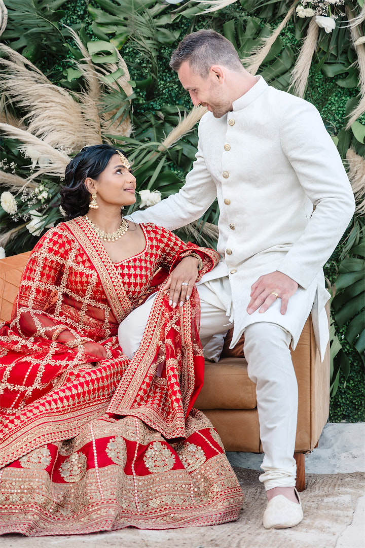 Bride and groom posing for Cancun wedding photographer.